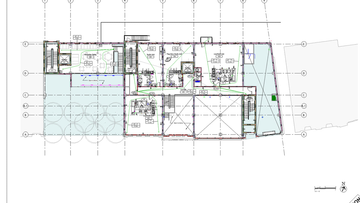 A Revit life safety plan showing the shading and green egress routes a view template applies