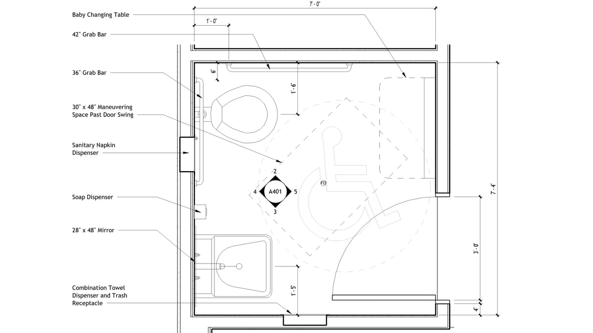 An enlarged Revit toilet room plan, every fixture keynoted with a text leader and dimensioned