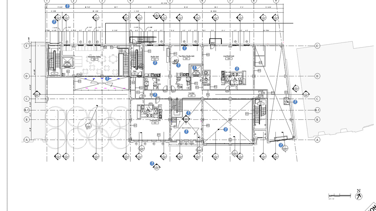 An annotated Revit floor plan placed on a sheet, with grid bubbles, room names and section marks