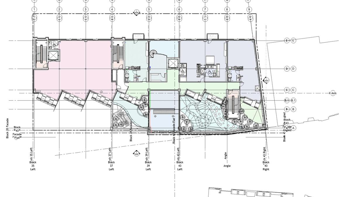 A Revit floor plan with every placed room shaded by a colour scheme, gaps left white